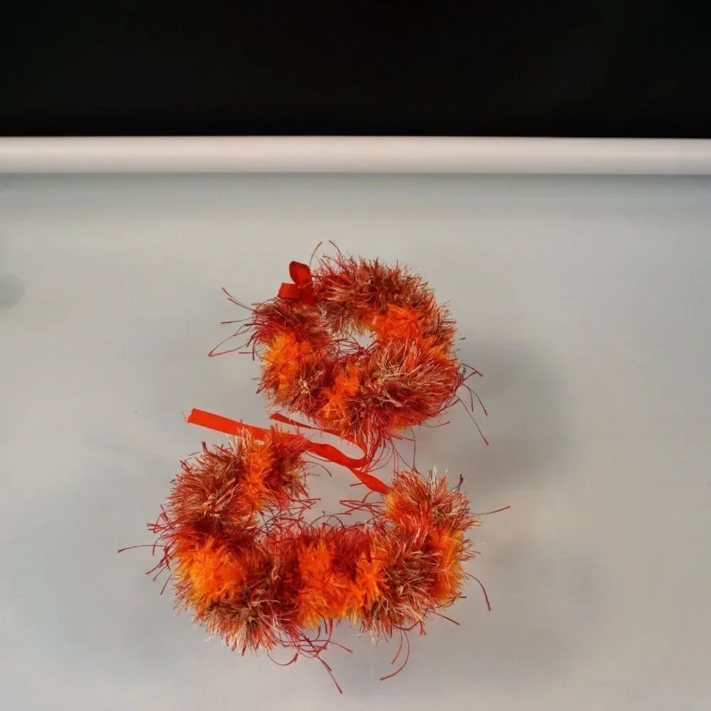 Kupee Wrist Lei Pair Red Orange Eyelash Yarn Tie-Ribbon